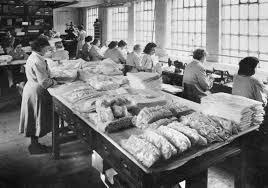 Black and white image of Workers in the shroud room